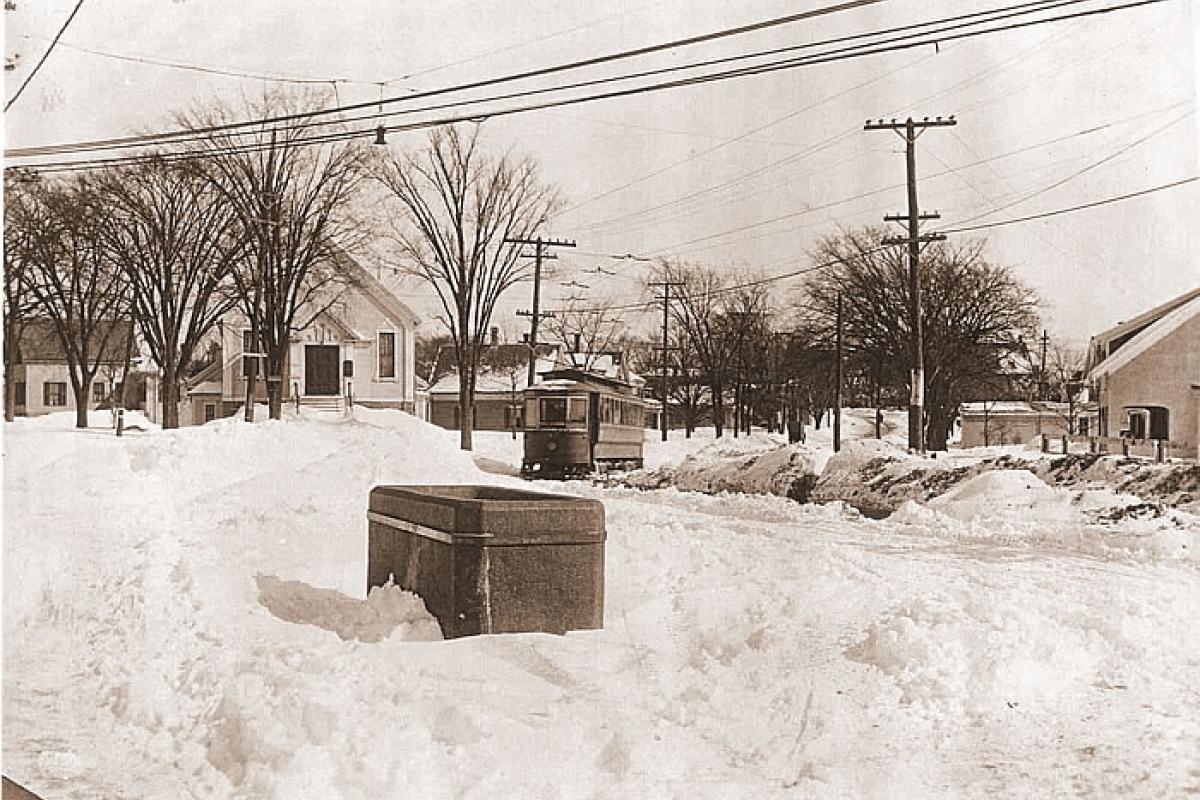 Bicknell Square in the snow. Unitarian Church in background as trolley moves down street. Image provided by: Jodi Purdy-Quinlan, Vice Chairman of the Weymouth Historical Commission