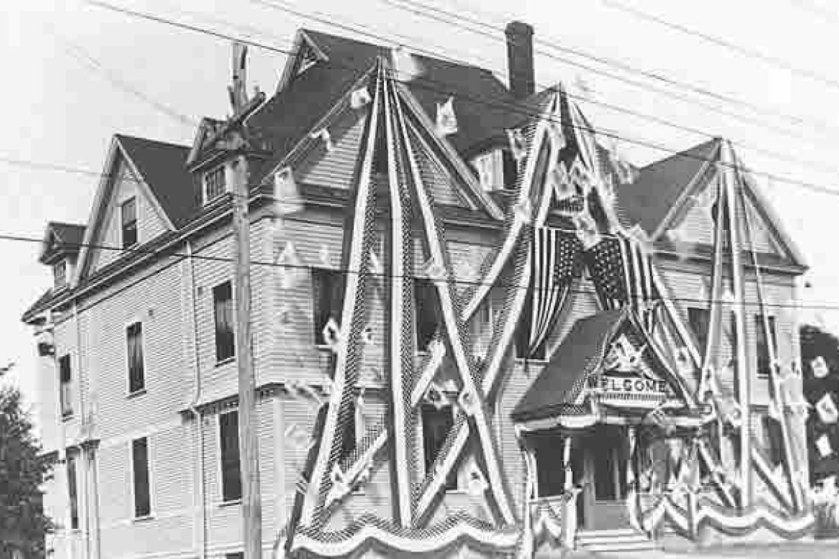 Masonic Temple on Broad Street. Decked out for the 4th of July. This Building was replaced by current brick building on Broad Street. Image provided by: Jodi Purdy-Quinlan, Vice Chairman of the Weymouth Historical Commission