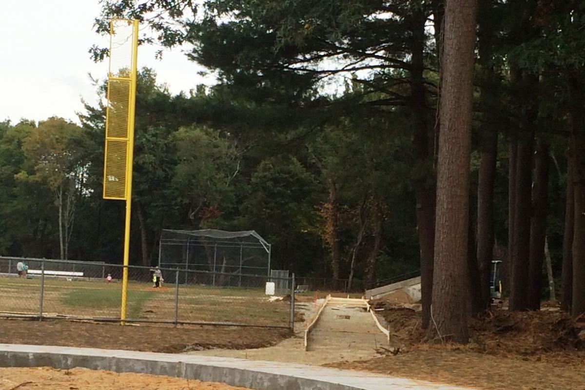 Walking path extended past playground and foul poles installed