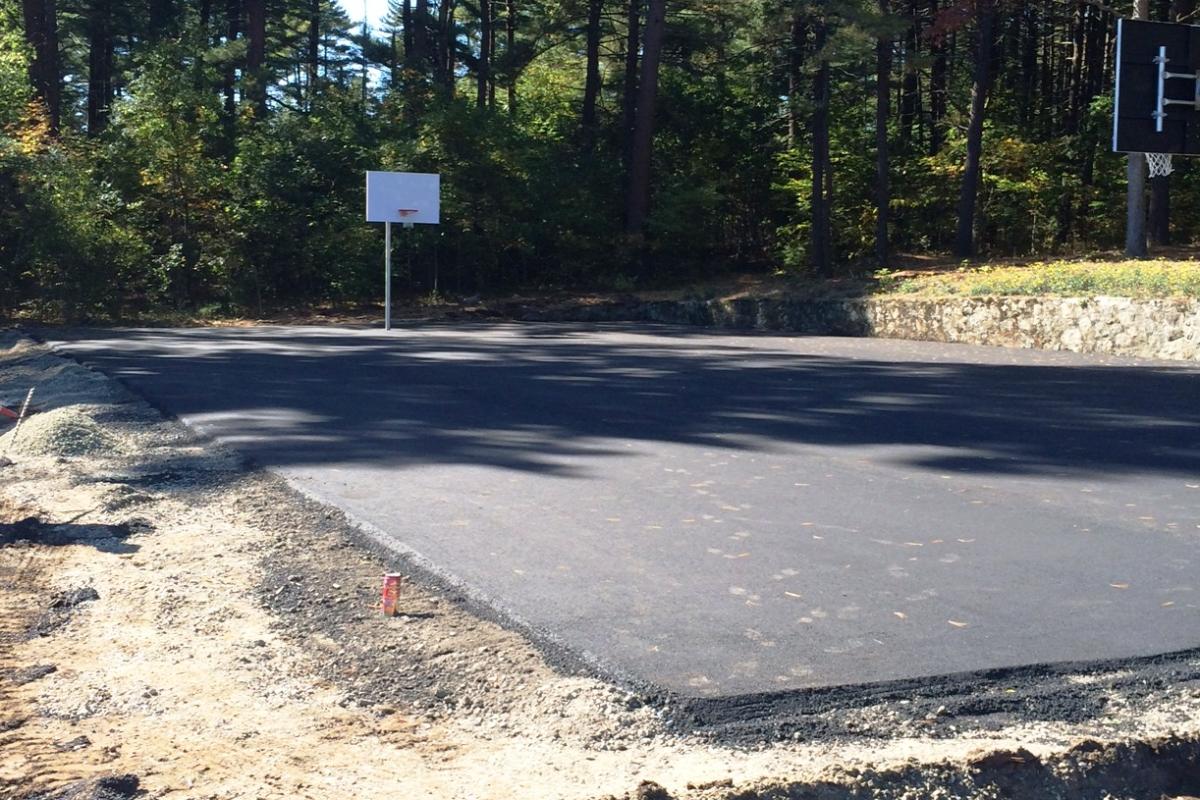 Basketball court expanded to regulation size with new hoops