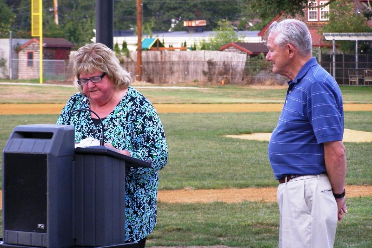 Mayor Kay presents Donald Mathewson, Historical Commission member and Bradford Hawes family descendant, with a proclamation recognizing his donation of the park's new dedication plaque.